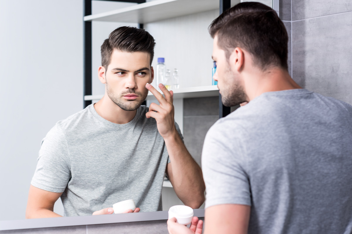 Man applying aftershave