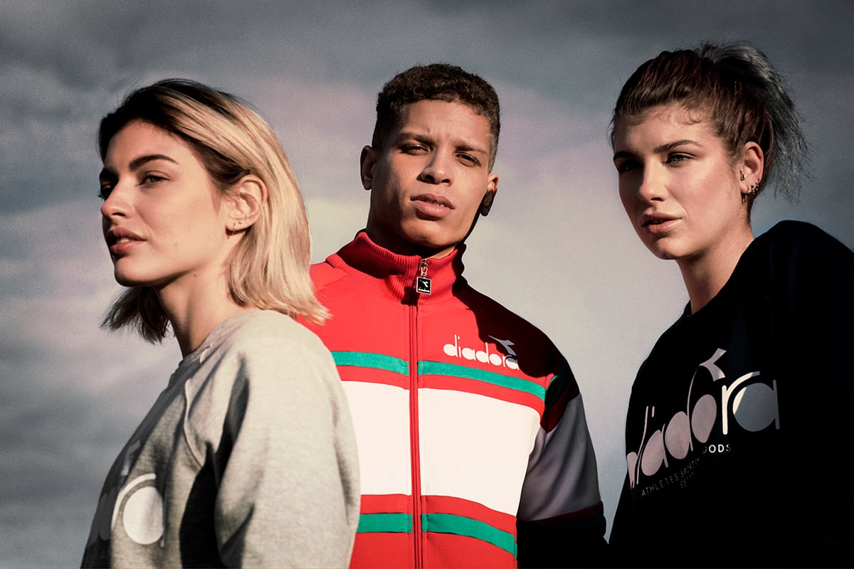 Models pose in Diadora clothing.