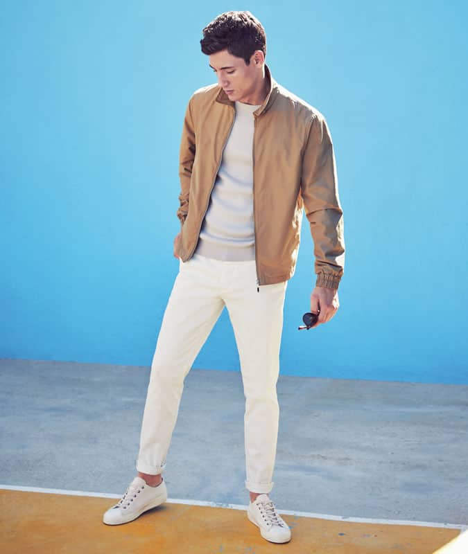 Men's all-white summer outfit with darker bomber jacket