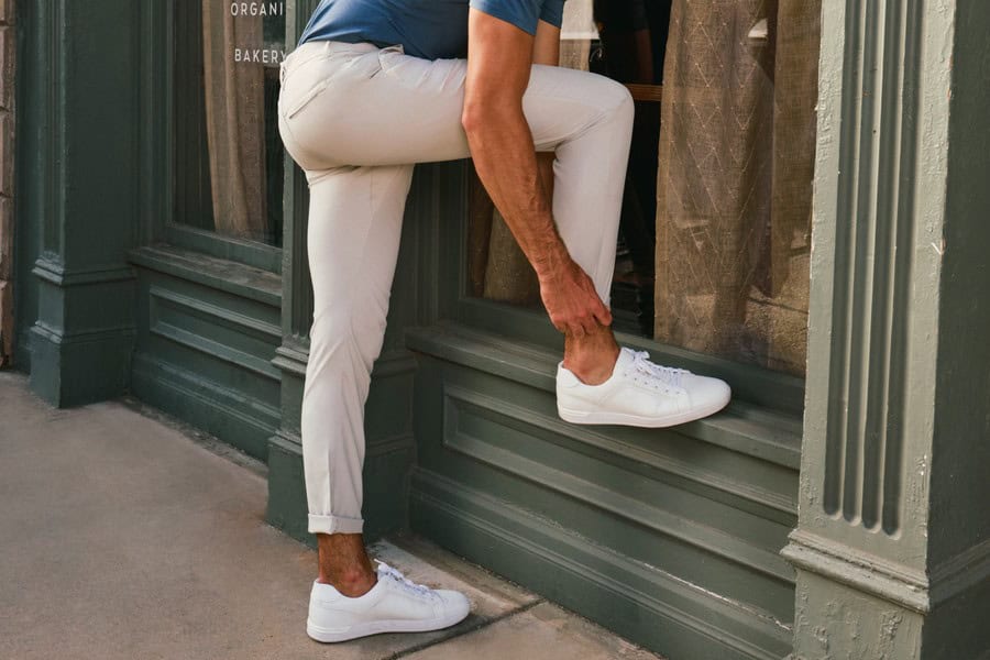 Man fixing hem of a Jack Archer Pants