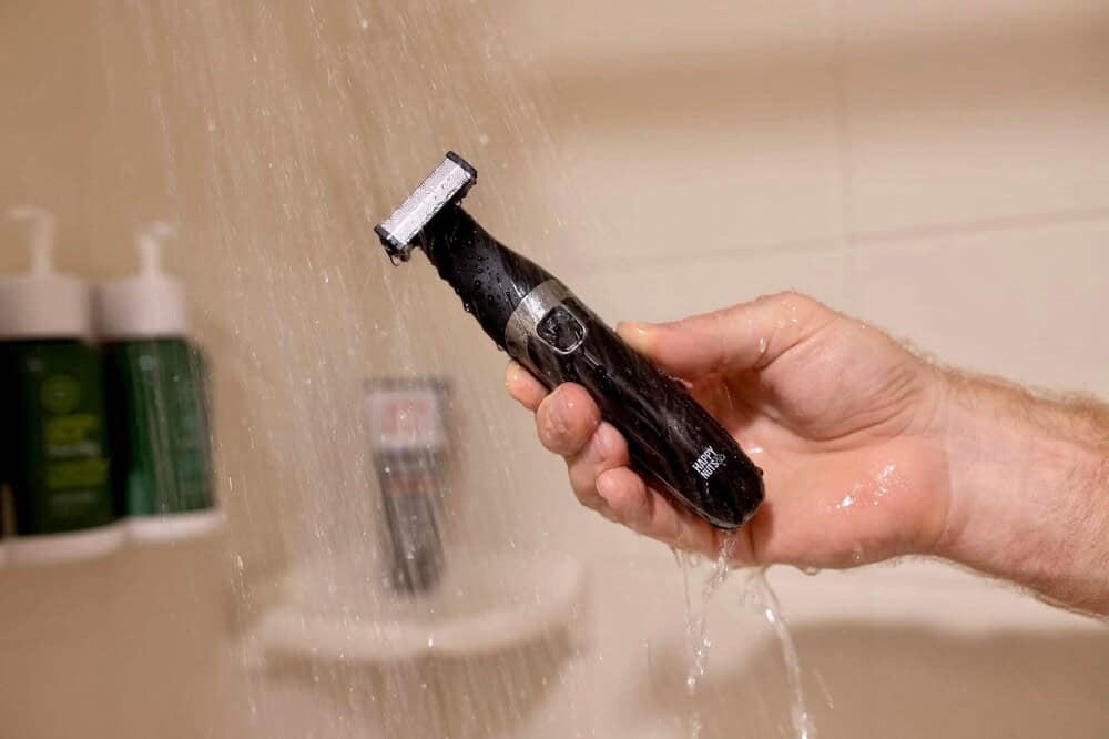 man washing a trimmer by happy nuts